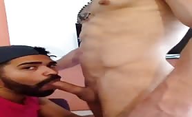 Cute bearded latino dude choking on a white cock