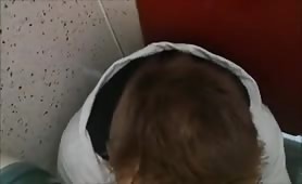 twink sucking big cock in public toilet stall.
