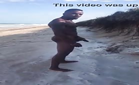 Well endowed black guy masturbates on the beach
