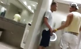 Caught dude sucking a sexy latin boy in a public restroom
