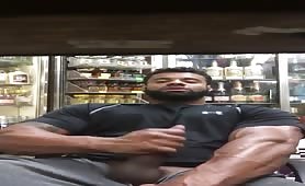 Big muscular liquor store worker stroking his huge cock