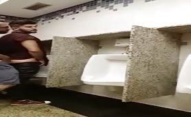 Cruising for sex and breeding a slul at a urinal while being watched...