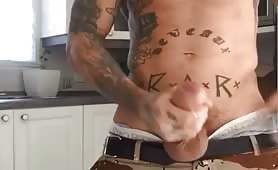White tatted thug stroking his fat cock