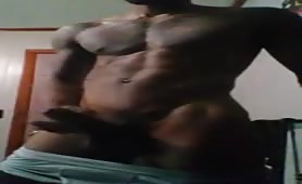 Handsome black rubbing his body and stroking his huge cock