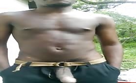 Young black guy showing off his cock outdoors