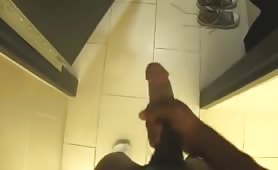 Horny young black puts on a show alone in a public toilet