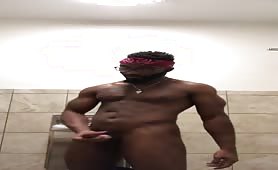 Stroking my dick in the gym bathroom 