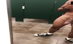 Exhibitionist masturbating in a public restroom
