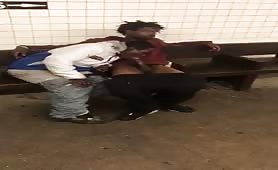 Two homeless black men having oral fun at a subway station