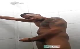 Hot latin guy stroking his cock in the shower