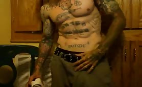White tattooed thug talking nasty on a webcam