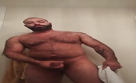 Big hairy bear stroking his fat cock
