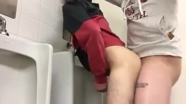 Grabbing a strangers cock in a public toilet - Videos pic