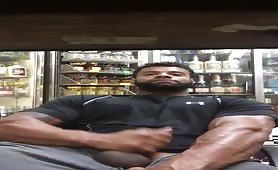 Big muscular liquor store worker stroking his huge cock