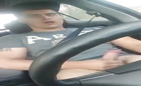 Hot stud masturbating while driving