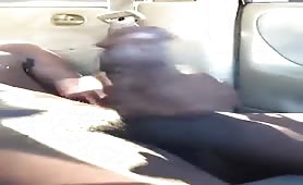 Black thug strooking his huge beefy fat cock in a car