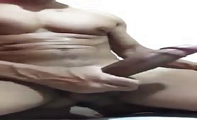 Hot well endowed muscular man doing a solo