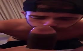Horny latino eating a monster black cock