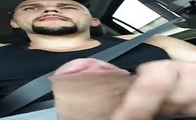 Handsome bald dude masturbating in his car