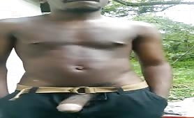 Young black guy showing off his cock outdoors