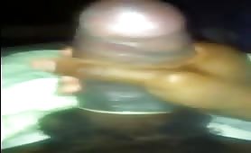 Nigga strokes his huge fat cock with the condom on