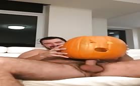 Horny stud fucking a pumpkin in halloween