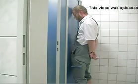 Sucking strangers in a public toilet glory hole