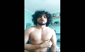 Long hair latino stroking his fat cock in front of the camera