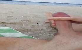 Stroking my cock and  relaxing on the beach