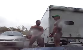Two strangers masturbate in a public parking lot