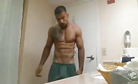 sexy guy undressing in bathroom