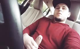 Cute young dude rubbing his cock in his car