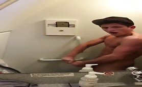 Young  dude having a huge orgasm in airplane's bathroom