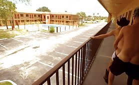 Two horny guys fucking in a motel balcony