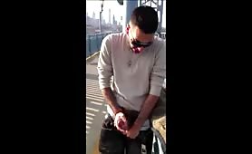 Young Latino masturbates in front of a NY bridge