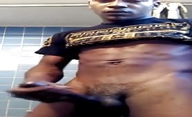 Cute young black dude rubbing his cock before showering