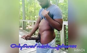 Horny black guy rubbing his huge piece on meat at the park