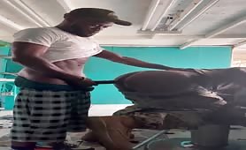 Two horny black workers fucking at the work side