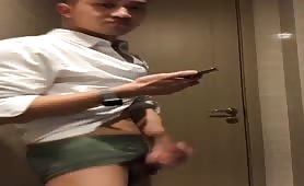 Horny  Asian guy  masturbates in the bathroom of the office where he works