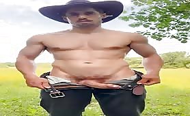 Handsome cowboy rubbing his cock on his farm