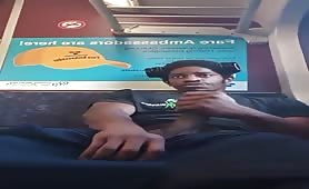 Young black dude rubbing his cock at the train station
