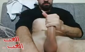 Handsome arab guy wanks his huge cock on webcam