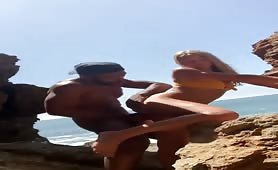 caught Muscled black having fun with a hot slut on the beach