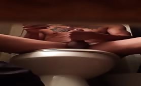 Spying Sexy dude jerking his cock on the toilet 