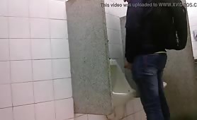 Man caught jerking his cock at the public urinals 