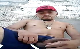 Latin thug beating his meat ouside