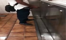 Straight guy showing his huge cock in a public toilet